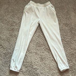 Off white velvet joggers    Two small stains in upper left thigh size Large
